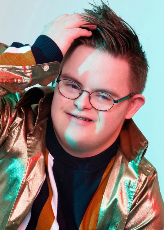 Jack has had several paid jobs as a model and has also worked with #Rankin for Hunger Magazine Jacks. His goal is to earn money so he can live independently and look after himself. Jack enjoys media and performing arts and now has a strong interest in photography after being inspired by Rankin. World Down Syndrome Day Zebedee Management collaborate with the #RadicalBeautyProject on their first ever group shoot for #WDSD. All the models featured have #DownSyndrome, and look every inch the #Supermodels they are. When it comes to Down syndrome, most people are so prejudiced (for many a reason, and we aim at challenging these reasons in the process) that they canā€™t see the forest for the trees and keep these very capable individuals back, in the shadows preferably. Actually, they are pretty sure thereā€™s no forest, they strongly believe thereā€™s just one tree called Down syndrome, end of. We are desperate to change that and reveal to everyone the huge forest beyond the trees, the endless abilities people with Down syndrome have, when given the chance! WDSD Ellie is a model and dancer who has Down SyndromeWDSD Ellie is a model and dancer who has Down Syndrome Ellie "These projects are so important to be part of because we still need to raise as much awareness as possible. Show the world our children are the same as everyone else. They ARE able to and do achieve their goals in life. There are still too many ignorant people!!! Ellie wants and needs to fulfil her hopes, dreams and aspirations in her life!!!! And that means being accepted and SEEN!! " Yvonne Goldstien- Ellie's mum. That is why we are beyond thrilled and excited to announce our unique collaboration with the pioneering and daring Radical Beauty Project. Its creator, choreographer Daniel Vais, believes like we do, in the incredible beauty, uniqueness and abilities of people with Down syndrome, and he worries about their doom. He is working on a high-end, avant-garde a